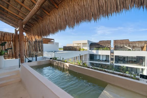 Ts'íibol: A warm 3-Bed Condo w a Private Rooftop Deck and Pool in Samsara Tulum
